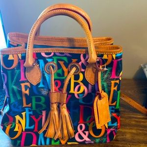 Dooney & Burke multiple color monogram bucket tote.